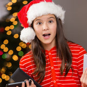 tween wearing Christmas hat